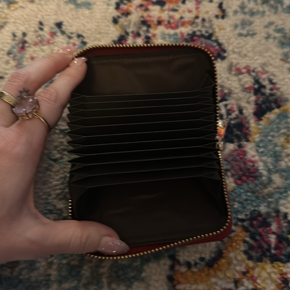 Deep red embossed with imprint detailing accordion zip around wallet - Picture 3 of 4